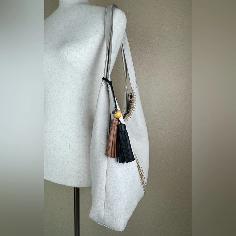 The Sak Huntley Hobo Bag. Ecru.Soft, Pebbled Leather w/Fabric Turquoise Interior - Picture 9 of 16